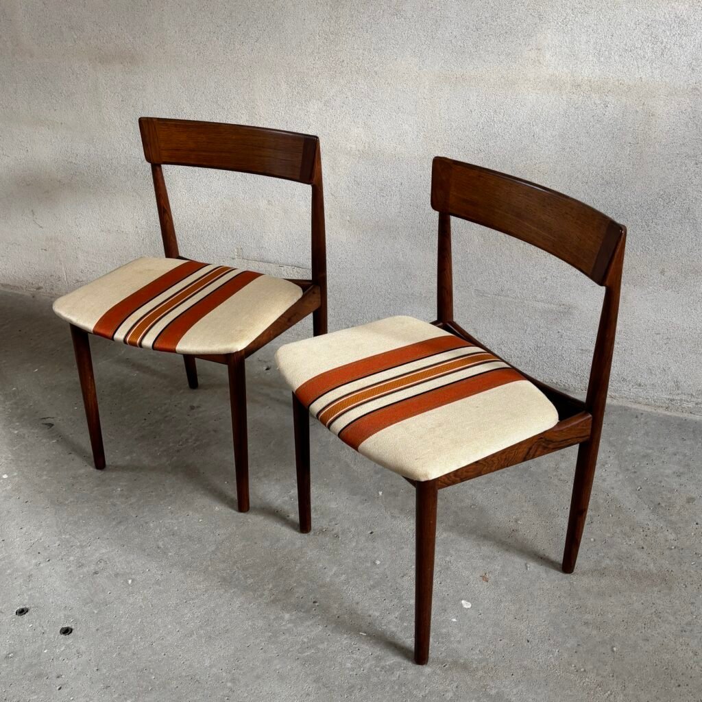 Pair of Rosengren Hansen Model 39 rosewood dining chairs with sculpted backrests and striped upholstery, Denmark, 1960s