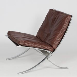 Steen Østergaard “Tango” lounge chair in chromed spring steel with original leather cushions, Denmark, 1960s